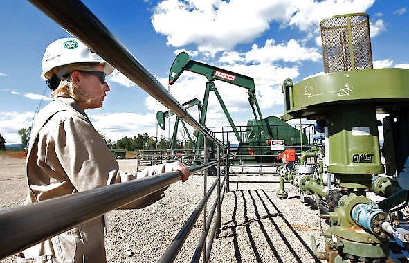 Kourtney Hardwick, BP Florida operations manager, looks over a methane gas well site Aug. 26, 2009, east of Bayfield, Colo. The well pad now has three gas wells that have been drilled and are producing natural gas. Jerry McBride | Associated Press