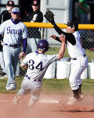 Bloomington South’s Nolan Rogers steals third base as Edgewood’s Mac Kido fields the throw during their April 4 game in Ellettsville. Rogers has 13 steals in the Panthers’ first eight games this season.Chris Howell | Herald-Times
