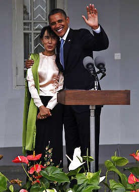 U.S. President Barack Obama waves his hand Monday as he is pictured with Myanmar opposition leader Aung San Suu Kyi at her lakeside residence in Yangon, Myanmar. Khin Maung Win | Associated Press