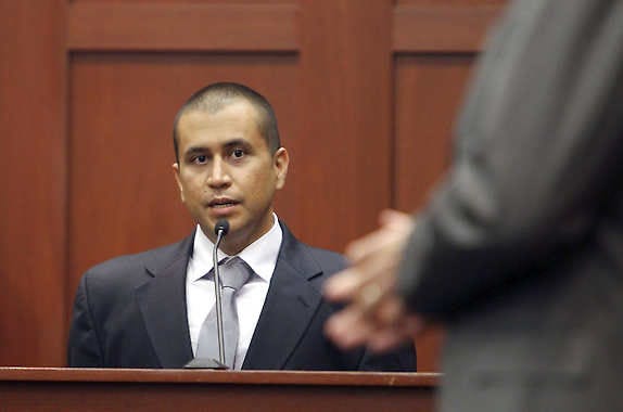 George Zimmerman, left, answers a question from attorney Mark O'Mara in the courtroom, Friday, April 20, 2012, during a bond hearing in Sanford, Fla. Circuit Judge Kenneth Lester says Zimmerman can be released on $150,000 bail as he awaits trial for the shooting death of Trayvon Martin. Zimmerman is charged with second-degree murder in the shooting of Martin. He claims self-defense. (AP Photo/Orlando Sentinel, Gary W. Green, Pool)