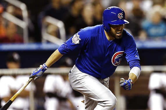 Chicago Cubs batter David DeJesus reacts after singling and driving one run in during the seventh inning against Miami on Saturday. J Pat Carter | Associated Press