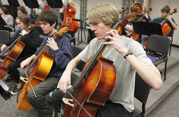 From left, Pilar Bearsch, John Oleson and Alex Knox practice on their cellos at Bloomington High School South. The students will play with the Hoosier Youth Philharmonic March 14 at New York City’s Carnegie Hall as part of a National Youth Concert. Jeremy Hogan | Herald-Times