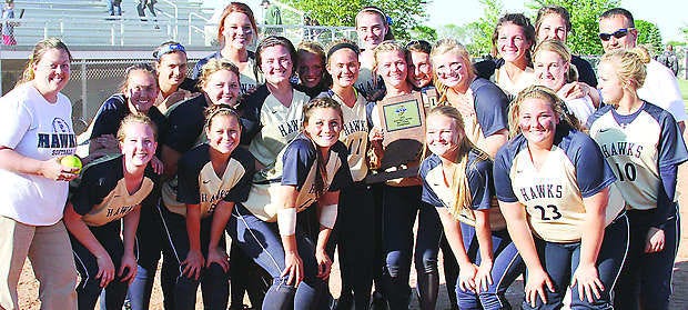 The Decatur Central softball team celebrates with its trophy after winning the Southport IHSAA sectional title by defeating Avon 8-3 Friday. Photo by Melissa Dillon.