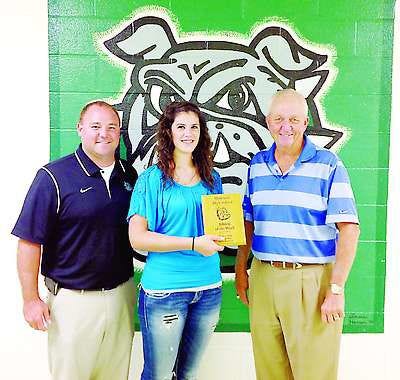 The Monrovia High School athlete of the week, sponsored by Nichols Insurance, is Kristal Smith. Smith is a volleyball player for the Bulldogs and she posted 15 kills, five solo blocks for points, five digs, two aces and 26 points scored. Presenting the award is, from left, Monrovia athletic director Brian Lewis, recipient Kristal Smith and Rex Nichols. Submitted photo.
