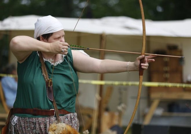 Tracy Whisner practices her archery skills Saturday during Heritage Days at Paynetown State Recreation Area.