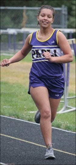 Junior Emily Coots enters the last leg of the 800-meter run April 21 in a meet against Springs Valley and Shoals. (Photo by Jeremy Nichols)