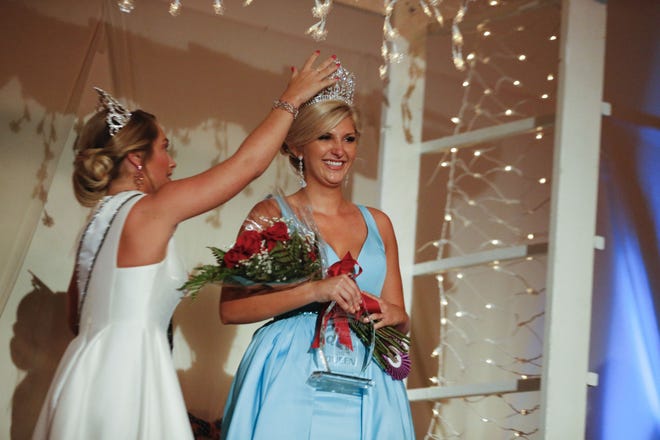 Kylee Jones is crowned the 2018 Monroe County Fair queen by 2017 queen Bethany Stanger, left, during the 2018 Miss Monroe County contest at the Monroe County fairgrounds. (Jeremy Hogan / Herald-Times)