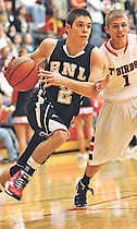BNL’s Jay Thomas drives past Eastern Greene’s Brody Martin during the first half Saturday night. The Stars lost, 67-52. GARET COBB | Times-Mail