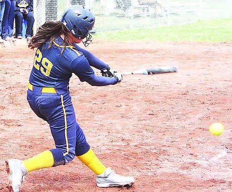 Mooresville shortstop Anee Frechette-Houchens, shown pounding a single earlier this season, hit a game-winning, two-run home run in the PioneersÕ Mid-State Conference victory over Plainfield on Wednesday. Photo by Steve Page.