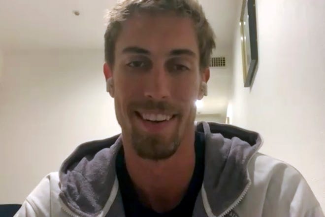 In this frame from video during a call with The Associated Press, beach volleyball player Taylor Crabb, of the United States, talks Saturday, July 24, 2021, about being forced to withdraw from the Olympics after testing positive for COVID-19 when he arrived to compete in the 2020 Summer Olympics in Tokyo, Japan.