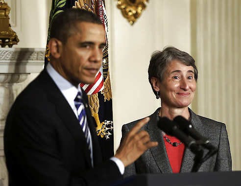 President Barack Obama points toward REI CEO Sally Jewell Feb. 6 as he announces that he is nominating her as the next interior secretary replacing outgoing Interior Secretary Ken Salazar, in the State Dining Room of the White House in Washington. Pablo Martinez Monsivais | Associated Press