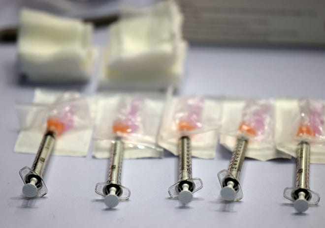 Doses of the Moderna COVID-19 vaccine. (Brad Horrigan/The Hartford Courant/TNS)