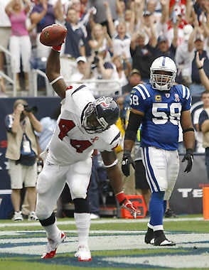 HOUSTON — Running back Ben Tate celebrates his touchdown in front of Indianapolis linebacker Gary Brackett during the first half Sunday. (Associated Press).