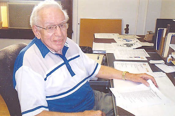 John Reed is shown at his desk at the Bedford Elks Lodge, where he has served as secretary the past 20 years. He is still on the job as he looks forward to observing his 90th birthday Sept. 24. (Special to the Times-Mail / CLAUDE PARSONS)