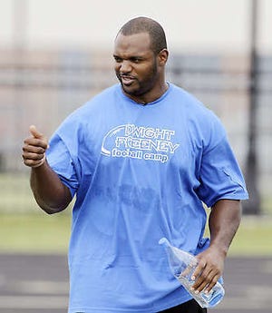 Dwight Freeney of the Indianapolis Colts gives a player the thumbs-up during the defensive end’s football camp in Indianapolis Wednesday.Darron Cummings | Associated Press