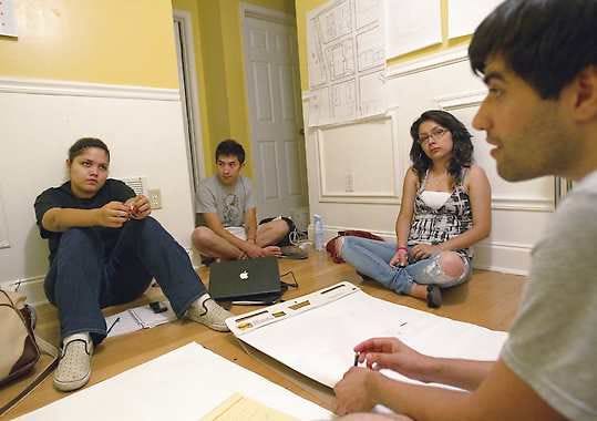 Georgina Perez, left, Adam Kuranishi, second from left, and Dulce Guerrero, third from left, take part in a meeting organizing Tuesday’s rally in Atlanta with activist Mohammad Abdollahi, right, where illegal immigrant high school students plan to tell their stories and “come out of the shadows.”David Goldman | Associated Press