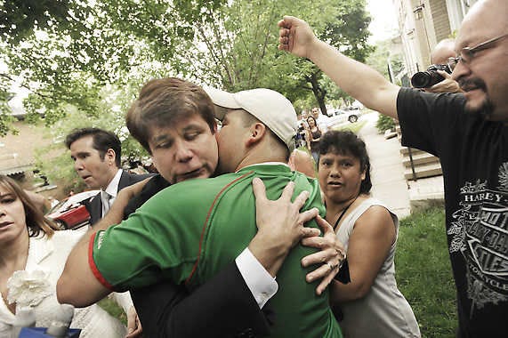 Former Illinois Gov. Rod Blagojevich left, hugs a supporter as he leaves his home Monday, June 27, 2011, in Chicago, heading to the federal court after jurors informed the judge that they had reached agreement on 18 of the 20 counts against him in his corruption retrial. (AP Photo/Paul Beaty)