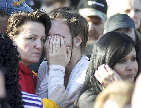 Students and their families react outside Millard South High School in Omaha, Neb., Wednesday, after a student opened fire, causing students to rush into a school kitchen to take cover.Dave Weaver | Associated Press