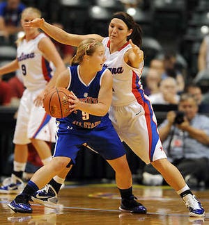 South standout and Indiana All-Star Kaila Hulls (11) defends Kentucky All-Star Maddie Peabody during Saturday’s game at Conseco Fieldhouse in Indianapolis. Hulls had 12 points as Indiana won 69-56 to split the two-game series.Chris Howell | Herald-Times