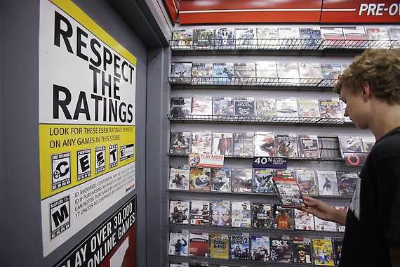 Jack Schooner, 16, looks at a “Grand Theft Auto” video game Monday at GameStop in Palo Alto, Calif. More on Monday’s court actions, page B5.Paul Sakuma | Associated Press