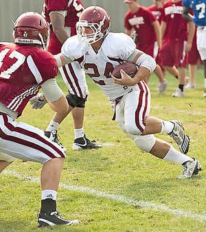 Indiana running back Matt Perez cuts inside linebacker Chase Hoobler (47) during drills Thursday on the IU practice fields. Perez, a redshirt freshman, is vying for playing time in a crowded backfield this fall. David Snodgress | Herald-Times