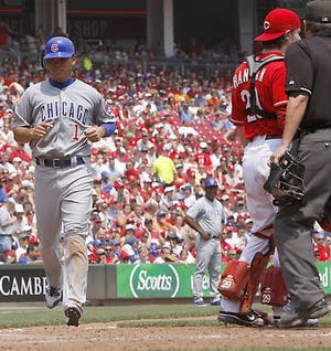 Chicago’s Kosuke Fukudome scores from third after a balk was called on Cincinnati’s Jose Arredondo in the seventh inning Wednesday in Cincinnati. The Cubs won 4-1.David Kohl | Associated Press
