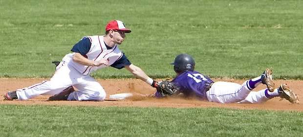 BEDFORD — BNL\'s jase Gratzer makes the tag on Bloomington South\'s Derek Gross for an out. (Times-Mail / PETE SCHREINER)