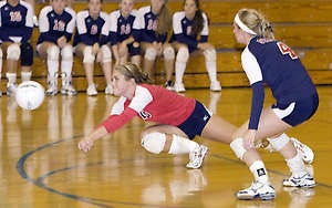 BEDFORD — BNL’s Alyssa Hansen attempts a dig as Autumn Deckard looks on during BNL’s match with Trinity Lutheran Monday. Trinity topped the Stars in five games. (Times-Mail photos / GARET COBB).