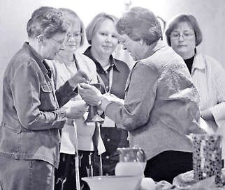 Bishop Deborah Kiesey, second from right, serves communion during a service at a United Methodist Church gathering of female pastors in Nashville, Tenn., in September. The United Methodist Church, one of the nation’s largest Protestant church bodies, is investigating how to shatter the “stained-glass ceiling” blocking female pastors from the pulpits of the denomination’s largest churches.Mark Humphrey | Associated Press