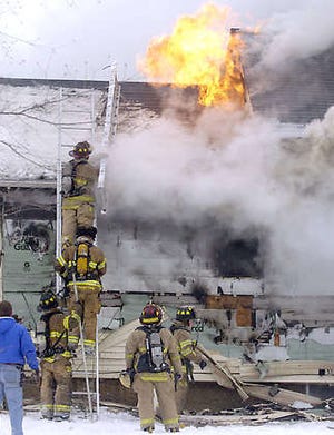 Fort Wayne firefighters battle a triple-fatal house fire Saturday in Fort Wayne.Ellie Bogue | Associated Press