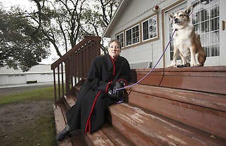 Sharon Pederson sits on a porch Jan. 5 with Kellen, her Norwegian lundehund dog, at a friend’s house in Petaluma, Calif. Pederson is a study subject who got deep brain stimulation, or DBS, surgery for her Parkinson’s disease. In DBS, a surgeon implants electrodes in the brain which are then connected to a pacemaker-like device that can be adjusted and turned off and on. The device sends tiny electrical pulses to the brain, disabling overactive nerve cells. Jeff Chiu | Associated Press