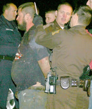 Morgan County Sheriff\'s deputies arrest Tim Bennington in October 2006 after the death of his father-in-law, Charlie Mason.Keith Rhoades | Reporter-Times