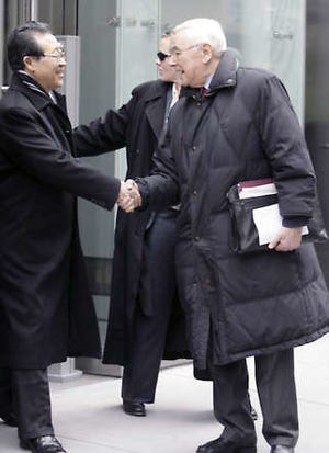 Kim Kye Gwan, North Korea’s vice foreign minister and lead nuclear negotiator, left, shakes hands Monday with George D. Schwab, president of the National Committee on American Foreign Policy, as he leaves the Korea Society after meetings in New York. Mary Altaffer | Associated Press