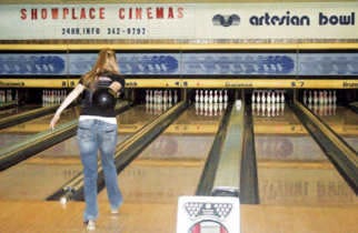 Above: Marilyn Vaught lines up to bowl a strike during Martinsville High School’s Business Professionals of America (BPA) club’s monthly social outing. The club members try to choose fun monthly outings that follow their motto “nearly free,” club coordinator Mary Tidd said. Below: A few members of BPA, Hayley Fulford, Angel Nunn, Cassy Brown, Morgan Gillaspy, Melissa Bearden, Allison Vaught and Marilyn Vaught have fun while they bowled Tuesday. Photos by Melissa Daniels.
