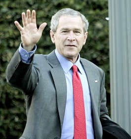 President Bush waves to reporters Sunday at St. John\'s Church in Washington. Evan Vucci | AP