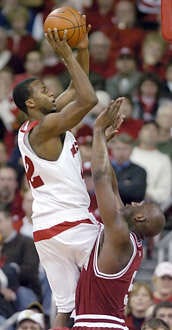 Wisconsin\'s Alando Tucker rises over Indiana\'s Marco Killingsworth for a shot in the second half of Wednesday night\'s game in Madison, Wis. Tucker scored a game-high 29 points in the Badgers\' 72-54 rout of the Hoosiers. Chris Howell | Herald-Times