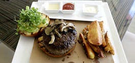The Old Homestead Steak House in Boca Raton, Fla., on Tuesday unveiled its 20-ounce, $100 slab of ground beef, billed as the "beluga caviar of hamburgers." J. Pat Carter | Associated Press