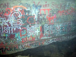 Graffiti covers the walls of a part of Buckner Cave. A new effort has begun to remove graffiti and trash from the cave to help restore it to a more pristine state. Sam Frushour | Courtesy photo