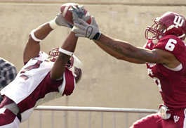 Southern Illinois cornerback Craig Turner (2) intercepts a Kellen Lewis pass intended for Indiana\'s James Bailey (6) during Saturday\'s game at Memorial Stadium.Monty Howell | Herald-Times
