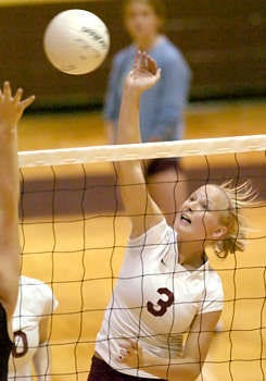 Norths Danielle Hobbs (3) goes for the kill during the Cougars volleyball match against Edgewood Thursday night. North won the match, 25-18, 25-10, 25-17.Monty Howell | Herald-Times