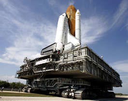 The space shuttle Discovery slowly makes its way to pad 39B at the Kennedy Space Center in Cape Canaveral, Fla., May 19. The move to the pad was a major step toward liftoff, which is now scheduled for next weekend. John Raoux | Associated Press