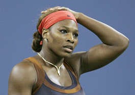 Serena Williams reacts during her 6-4, 0-6, 6-2 loss to top-seeded Amelie Mauresmo in the fourth round of the U.S. Open Monday in New York. Ann Heisenfelt | Associated Press