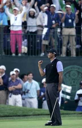 Tiger Woods reacts after making eagle on 18 to finish Saturday’s third round of the U.S. Open at Torrey Pines Golf Course in San Diego. Woods has a 1-shot lead heading into today’s final round.Charlie Riedel | Associated Press