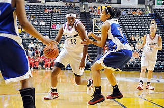 Indiana All-Star Alex Guyton drives the lane against Kentucky All-Star Chantelle Pressley during the girls All-Star game at Conseco Fieldhouse in Indianapolis on Friday. Guyton, a North standout headed to Purdue, scored a game-high 12 points in a losing effort. Chris Howell | Herald-Times