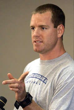Cincinnati Bengals quarterback Carson Palmer speaks at a news conference Saturday prior to the first practice at training camp in Georgetown, Ky. Palmer was describing drawings he received from grade school children that showed how his leg was bent when he was injured last season. Al Behrman | Associated Press