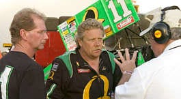 Steve Kinser (center) and crew chief Scott Gerkin talk with a race official Friday night at Bloomington Speedway. Steve Kinser celebrated his 52nd birthday at the track, his first race in Bloomington since 1999.David Snodgress | Herald-Times