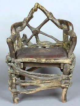 This chair, made from tree roots nailed together, was once owned by Al Capone, the gangster. It sold this spring for $3,360 at a Leslie Hindman Auctioneers auction in Chicago. Cowles Syndicate Inc.