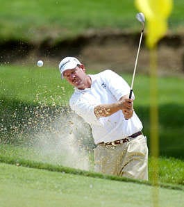 Bart Bryant blasts out a greenside bunker on No. 4 during Sunday\'s final round of the Memorial Tournament in Dublin, Ohio. Bryant went on to win by one stroke.Chris Putman | Associated Press