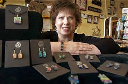 Terry Taylor-Norbu creates dichroic glass necklaces and earrings. David Snodgress | Herald-Times