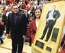 Purdue coach Gene Keady is presented with a piece of a former Assembly Hall court with his likeness painted on it before Tuesday night\'s game against the Hoosiers. Keady is coaching his final season with the Boilermakers. AP photo